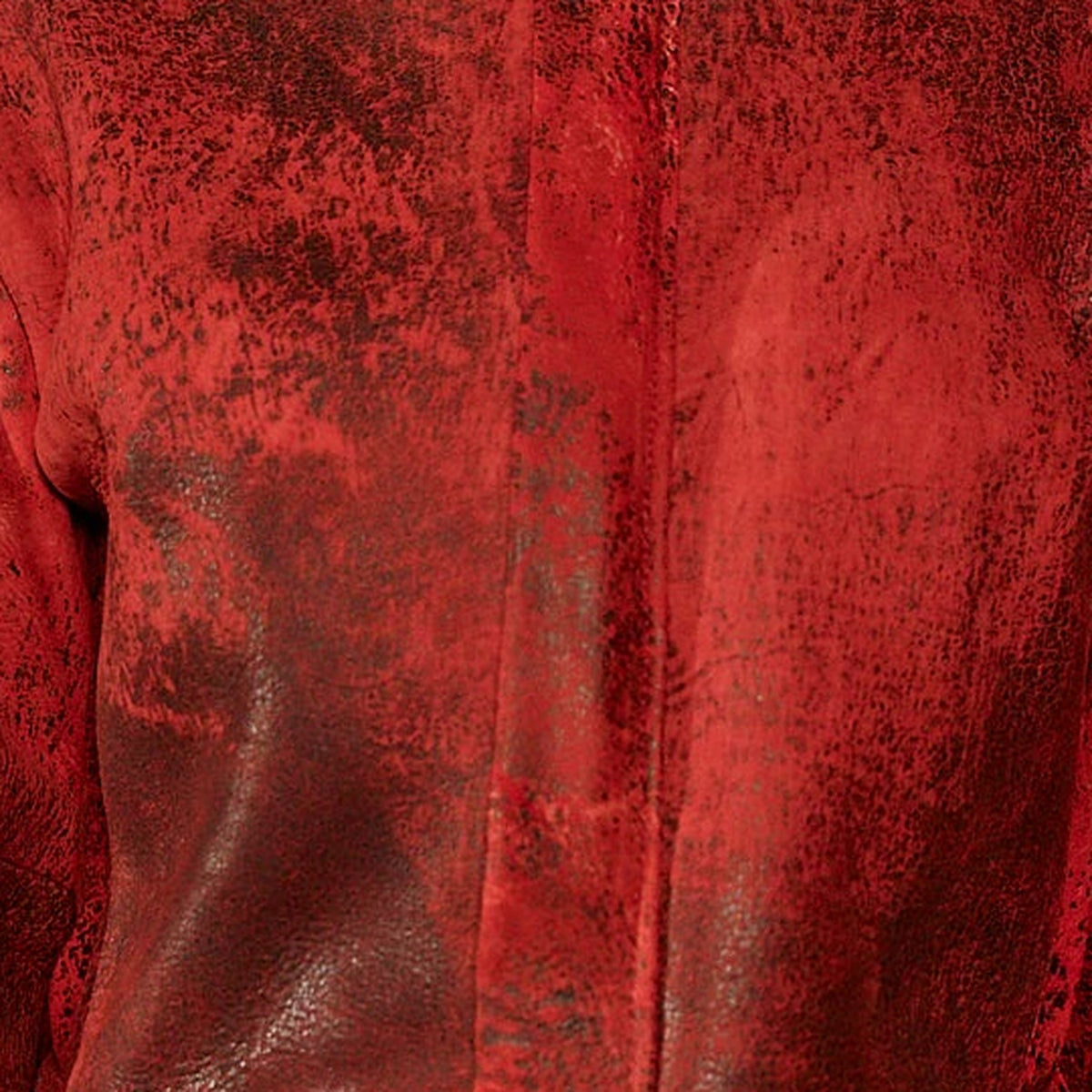 Red aged leather in close-up, central placket and glossy grain, SALOMÉ jacket
